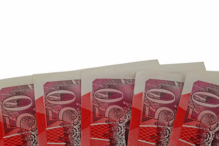 Sterling notes â€“ Five fifty pound notes isolated on a white background.