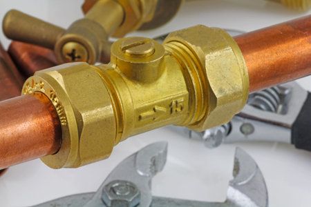 New copper pipework ready for construction â€“ Adjustable wrench, 15mm copper piping and brass...