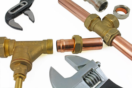 New copper pipework ready for construction â€“ Adjustable wrench, 15mm copper piping and brass...