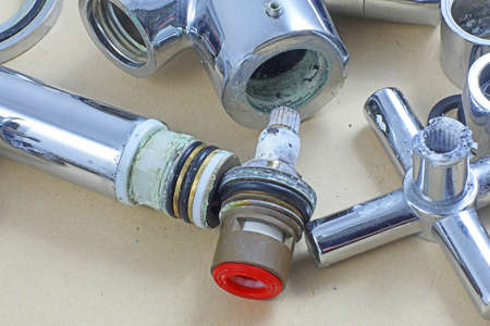 Dismantled ceramic tap/faucet waiting for service or repair.の写真素材
