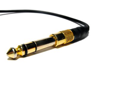 Close-up of 1/4" Stereo phono cable and plug, on white background.の写真素材