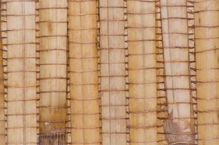 Woven pattern background with bamboo and grassの写真素材