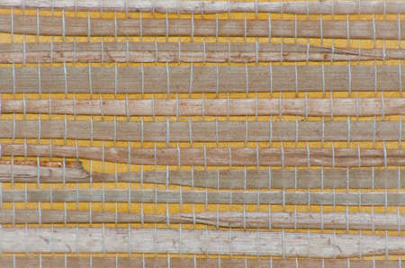 Woven pattern background with bamboo and grassの写真素材