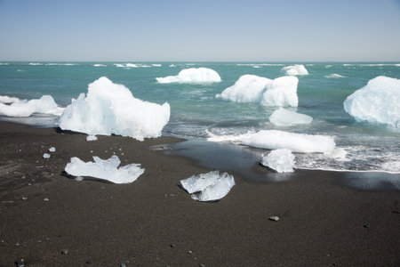 Ice from Jokullsarlon jpushing into the sea and washed onto the beach.