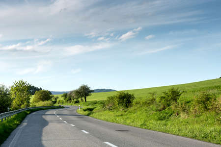 Empty asphalt road with cloudy skyの写真素材