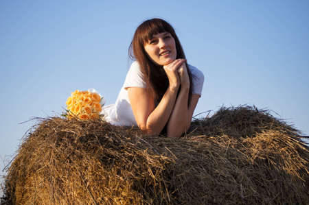 The young beautiful girl on the natureの写真素材