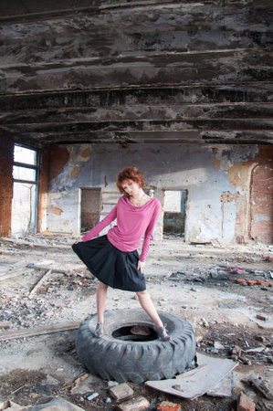 Walking girl in an abandoned buildingの写真素材