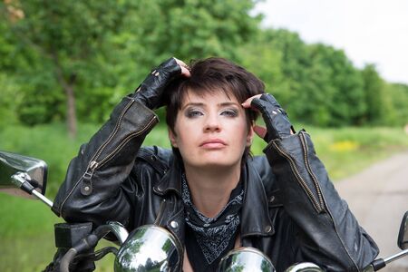 Stylish girl on a bikeの写真素材