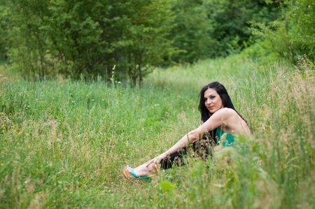 Young beautiful girl posing at outdoorの写真素材