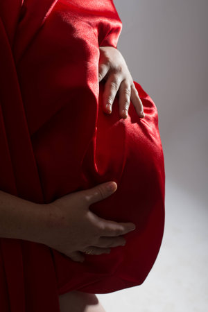 Portrait of a young beautiful pregnant girlの写真素材