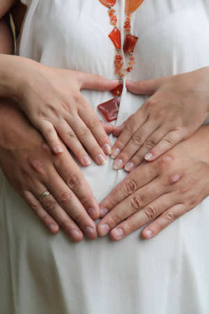 Portrait of a young beautiful pregnant girlの写真素材