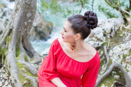 Portrait of a beautiful young girl on nature