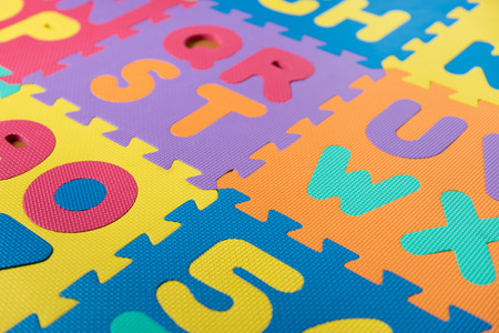 A section of a colorful foam ABC puzzle/floor mat.の写真素材