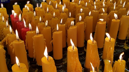 Candles light, praying to the mercy godの写真素材