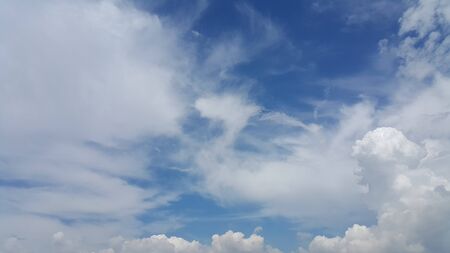 Blue sky and fluffy cloudの写真素材