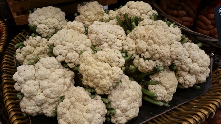 White cauliflowers stack in the basket.の写真素材