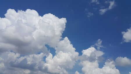 The blue sky and the huge white cloud.の写真素材