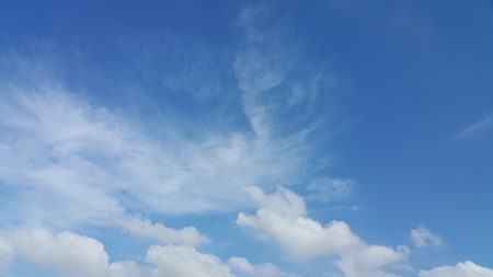 Blue sky and fluffy clouds.の写真素材