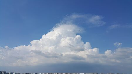 Big white cloud over the city.の写真素材