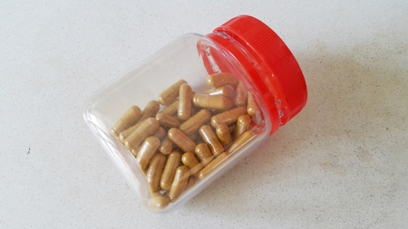 A bottle of Chinese herbal capsules.の写真素材