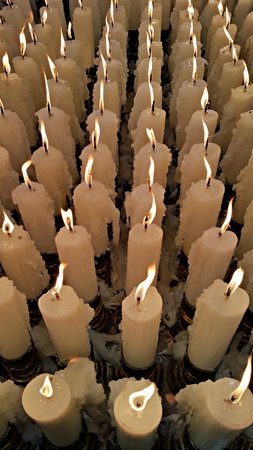 Candle light up, offering to the Godnessの写真素材