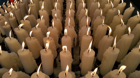 Candle light up, offering to the Godnessの写真素材