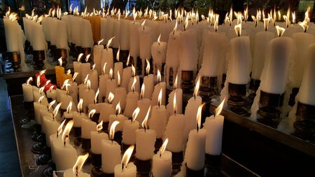 Candle light up, offering to the Godnessの写真素材