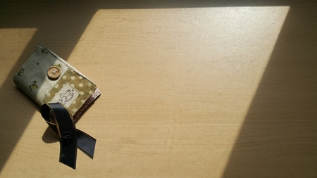 Black bow stack on the card holder.の写真素材