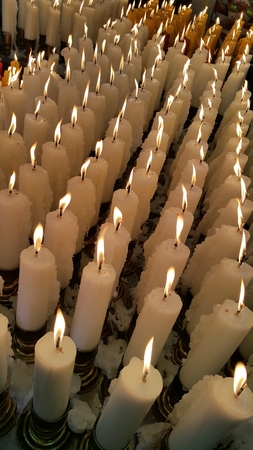 Candle light up, offering to the Godnessの写真素材