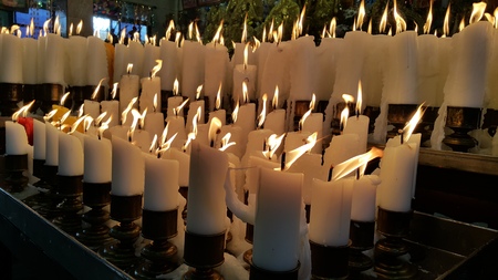 Candle light up, offering to the Godnessの写真素材