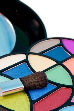 close up of multicolored eyeshadow kit with applicatorの写真素材