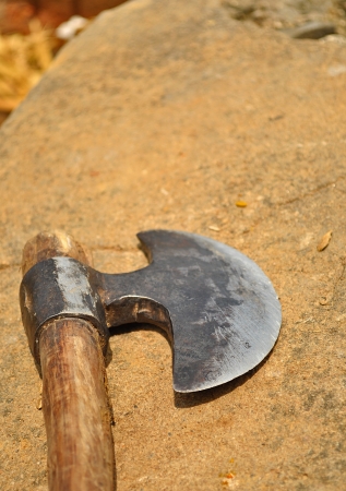 close up of axe lying on groundの写真素材