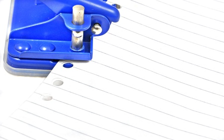 blue punching machine with punched paperの写真素材