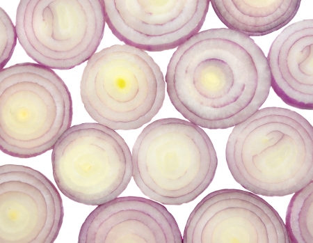 clsoe up top view of slices of onion arranged on white の写真素材