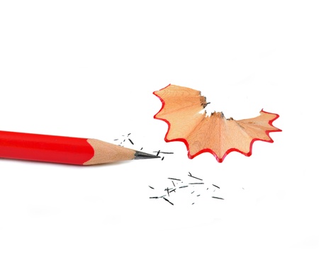 close up of red pencil and shave arranged on white の写真素材