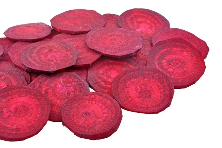 sliced beet root arranged on white 