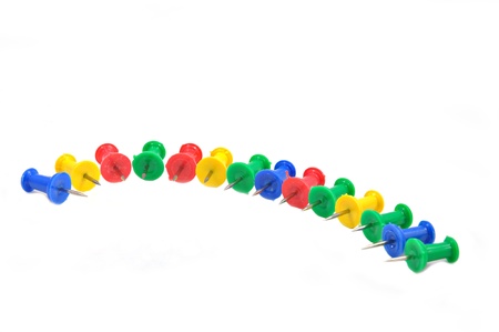 arranged colorful pushpins on white の写真素材