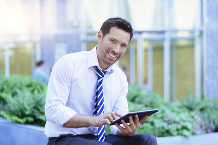 Businessman networking in the streetの写真素材