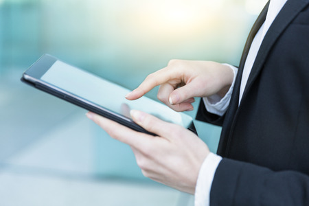 close up of a Businesswoman hands using tabletの写真素材