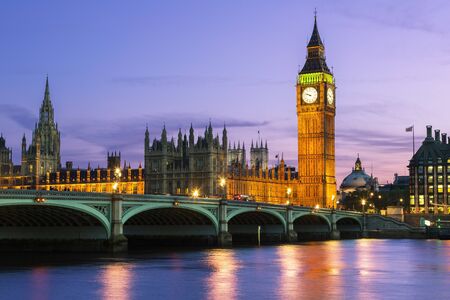 London, parliament building and Westminster Bridge at Duskの写真素材