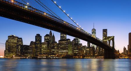 New York City, panoramic view of Brooklyn Bridge by nightの写真素材
