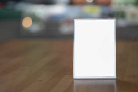 Mockup blank white screen advertising board or showcase billboard in modern department store. Mock...