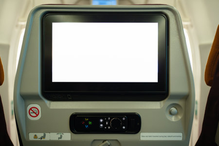 Close-up of an airplane seat with a white screen in the cabinの写真素材
