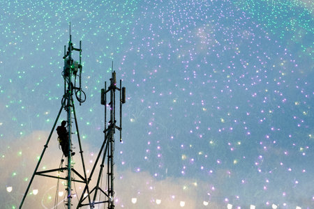 Telecommunication tower in the sky with colorful firework background at night