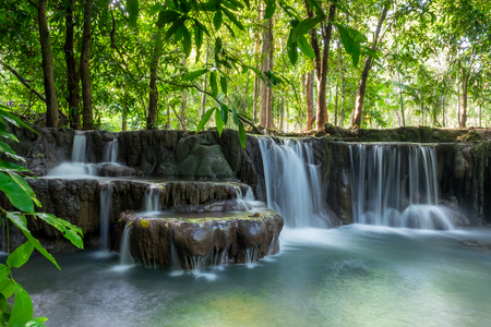 Beautiful small waterfalls hidden in the tropical jungle of Thailand. Few people will know this place because the path is still very wildの写真素材