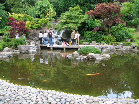 London, UK - July 05, 2008: Visitors to the Holland Park in London. The Kyoto Garden was created in 1991.のeditorial素材