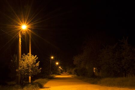 Night country road with a street lampsの写真素材