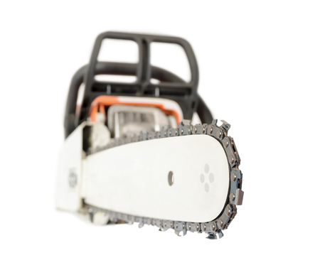 Close up view of petrol chainsaw. Different focus on right side. Isolated on white background の写真素材