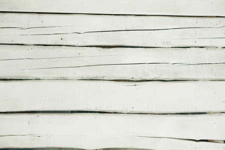texture of wooden fence with a cracked white paintの写真素材