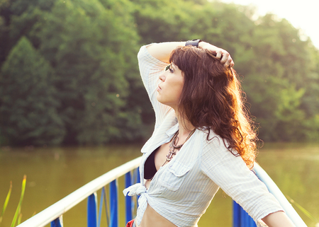Close up outdoor portrait in face profile of beautiful womanの写真素材